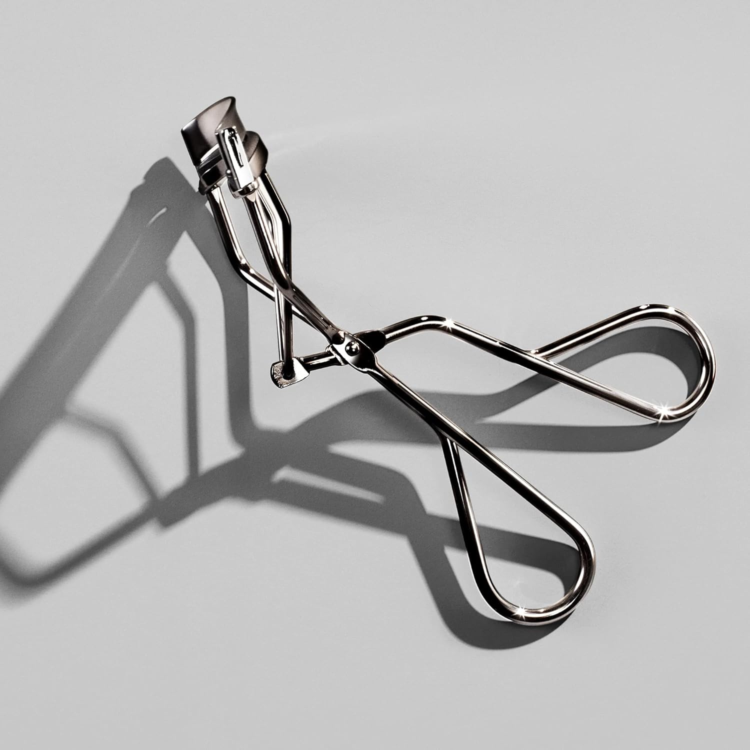 Eyelash Curler - Crimps & Curls Lashes for Perfect, Eye-Framing Fringe - Gentle & Safe - Includes Replacement Pad